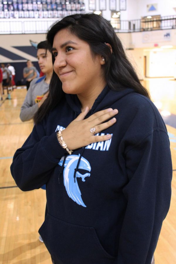 Junior Gretel Calderon stands for the Pledge of Allegiance (Photo by Alexis Lee). 