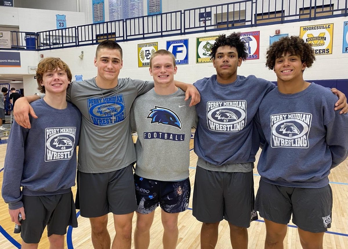 (Left to right) Taylor, McClure, Huckaby, Dale and Young pose for a picture following a senior year dual. 
Photo provided by Elizabeth McClure