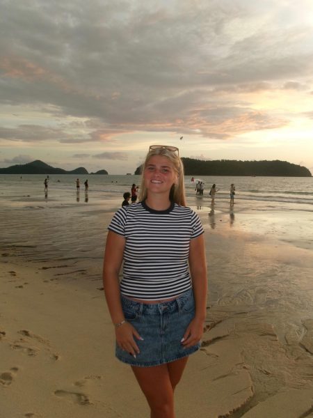 Grace Paul poses for a picture on a Malaysian beach. Photo by Angela Paul.