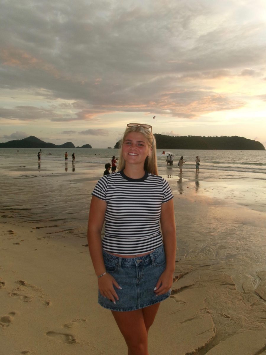 Grace Paul poses for a picture on a Malaysian beach. Photo by Angela Paul.