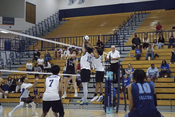 Boys volleyball in action.