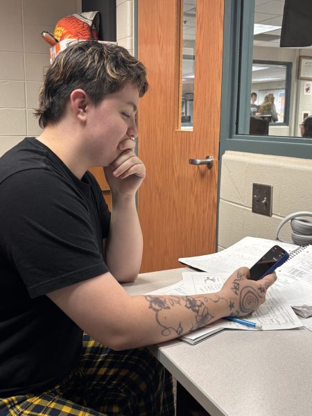 Nathalia Gumiran uses her phone for help on math equations. Photo taken by Ash Brown